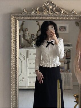 White Ruffle Hem Knit Cardigan with Black Bow